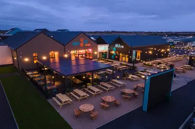 an aerial view of a resort with tables and chairs at Your Seaside Escape at St Osyth Modern caravan with decking and wifi and parking Nr to Clacton on Sea in Saint Osyth