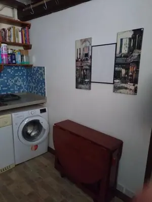 a bathroom with a washing machine and a washer at The Old Sweet Shop in Harwich
