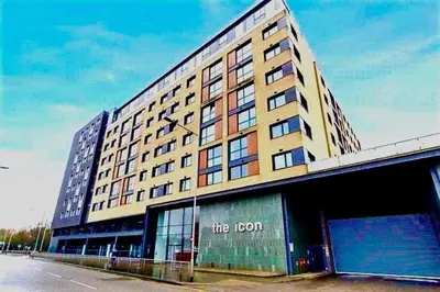a large building with the hotel on the side of it at Modern 2 Bed Flat with parking Next to Basildon Station in Laindon