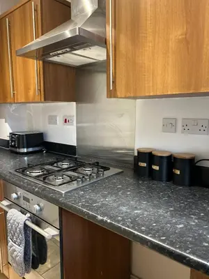 a kitchen with a stove and a counter top at Stunning 2BR house in Colchester in Colchester