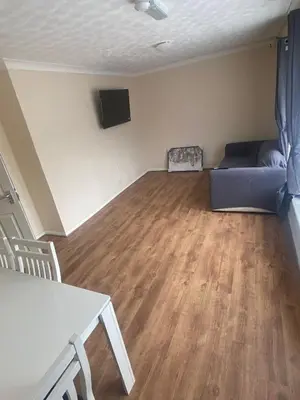 a living room with a couch and a table at Spacious Double Room in Basildon Essex in Basildon