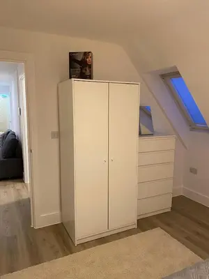 a white cabinet in a room with a window at Modern Stay - Walk to Everything 6 in Ipswich