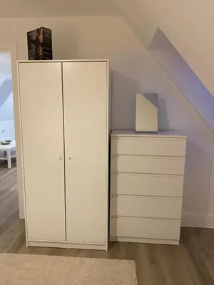 a white cabinet in a room with a staircase at Modern Stay - Walk to Everything 6 in Ipswich