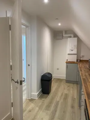 an empty kitchen with a trash can in a room at Modern Stay - Walk to Everything 6 in Ipswich