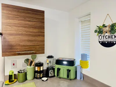 a kitchen counter with a coffee maker on a counter at Entire 3-Bed Home, 5 mins to City Centre, Sleeps 6, 2 Free Parking in Colchester
