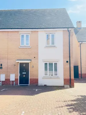 a brick house with a black door on a street at Entire 3-Bed Home, 5 mins to City Centre, Sleeps 6, 2 Free Parking in Colchester