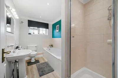 a bathroom with a shower and a sink and a tub at Detached 6 Bedroom Cambridgeshire Abode - Pets in Whittlesford