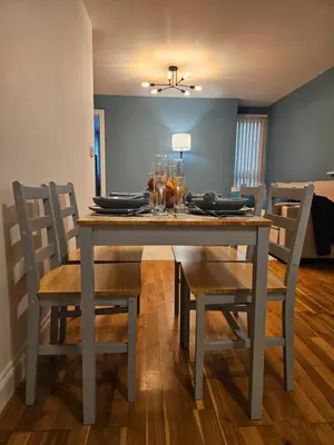 a dining room table with chairs and a table and chairsktop at Gorgeous Flat with Charming Patio in Cambridge