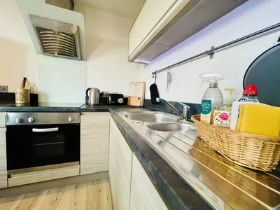 a kitchen with a sink and a counter top at 503 Focus Apartments in Ipswich