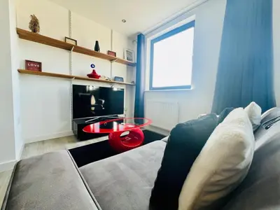 a living room with a couch and a table at 503 Focus Apartments in Ipswich