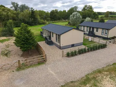 an overhead view of a small house with a yard at Pullman Lodge in Glemsford