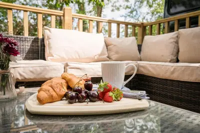 a plate of food on a table on a patio at The Bus Stop, Thornham Magna in Thornham Magna