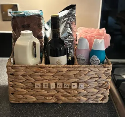 a basket filled with bottles of wine and detergents at Cosy central hideout in Ware