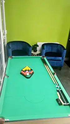 a green pool table with afits at Relaxed Leigh-on-Sea Escape, Family-Friendly & Contractor Stays in Hockley