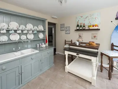 a kitchen with a sink and a piano in it at The Porterhouse Pub & Restaurant Cambridge in Willingham