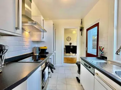 a kitchen with a sink and a counter top at Contractors, Long stay,WI-Fl, Garden, parking in Chelmsford