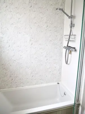 a bathroom with a shower and a bath tub at Cosy Room in Debenham in Debenham