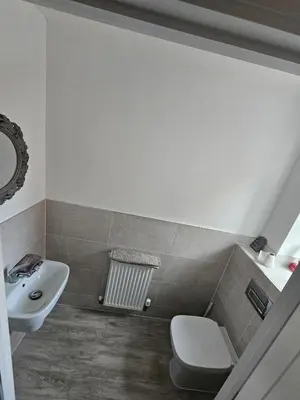 a bathroom with a toilet and a sink at Bright spacious room in Manningtree in Manningtree