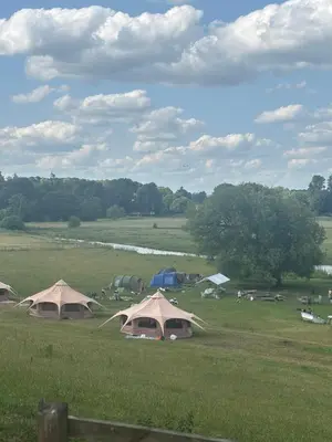 a group of tents in a field in a field at Farm stay belltent activities in Bramfield