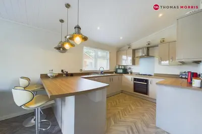 a kitchen with a wooden counter top in a room at Lakeside Lodge Retreat with Views in Fenstanton