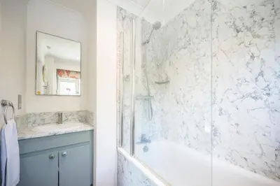 a bathroom with a shower and a tub and a sink at NO 108, private room in Aldeburgh in Aldeburgh