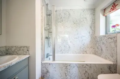 a bathroom with a tub and a sink at NO 108, private room in Aldeburgh in Aldeburgh