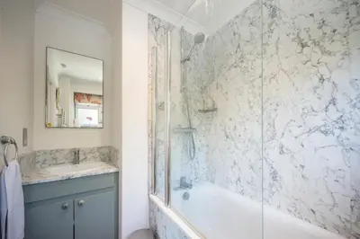 a bathroom with a shower and a tub and a sink at NO 108, private room in Aldeburgh in Aldeburgh