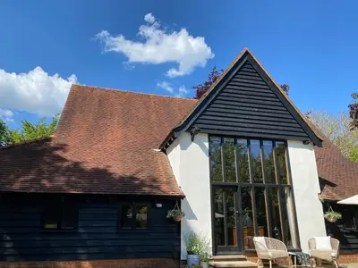a house with a black and white roof at Lucas farm barn