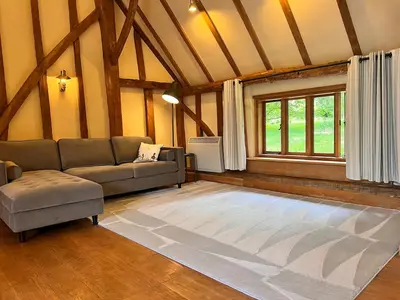 a living room with a couch and a window at Lucas farm barn