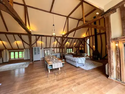 a large living room with a table and a couch at Lucas farm barn