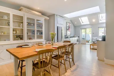a kitchen with a long wooden table and chairs at 3 Bed in Aldeburgh oc-f32700 in Aldeburgh