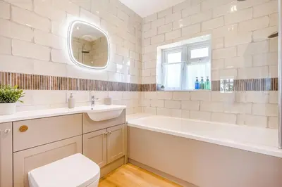 a bathroom with a tub and a toilet and a sink at 3 Bed in Little Clacton oc-l32526 in Little Clacton