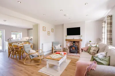 a living room with a couch and a table at 3 Bed in Little Clacton oc-l32526 in Little Clacton