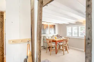 a dining room with a wooden table and chairs at 2 Bed in Dedham oc-c32543 in Dedham