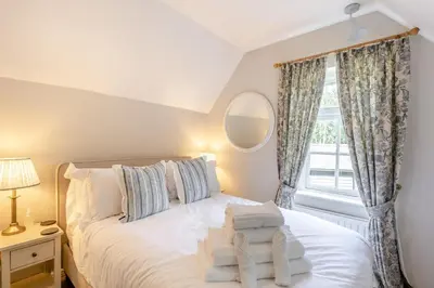 a bedroom with a white bed with a window at 2 Bed in Dedham oc-c32543 in Dedham