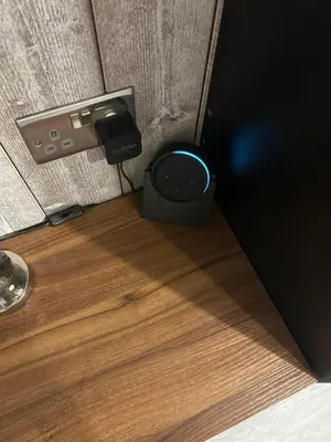 a speaker sitting on the floor next to a wall at Somewhere Nice & Cozy in Little Clacton
