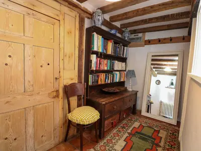 a room with a desk and a book shelf with books at Bank House in Norwich