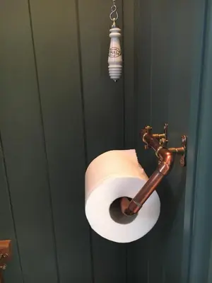 a roll of toilet paper hanging on a wall at The Scrumpy Shepherd, Brandeston in Blundeston