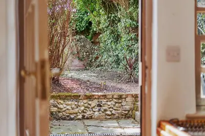 a view of a stone path through a door at 136 Southgate St, Bury St Edmunds in Bury Saint Edmunds