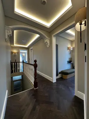 a hallway with a stairway with a ceiling at Canewdon Rd Luxury Accommodation in Westcliff On Sea