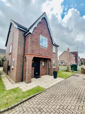 a red brick house with a black door at Luxury Homely Stay Near City Centre With Parking in Colchester