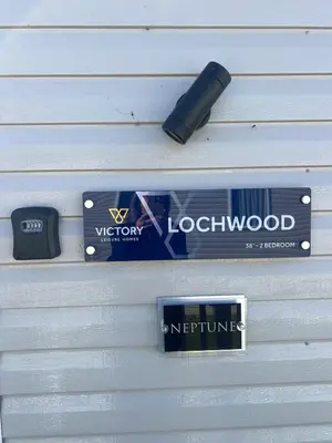 a close up of two signs on a wall at Neptune in Parkeston