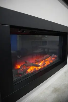 a fireplace with some food cooking in it at Neptune in Parkeston