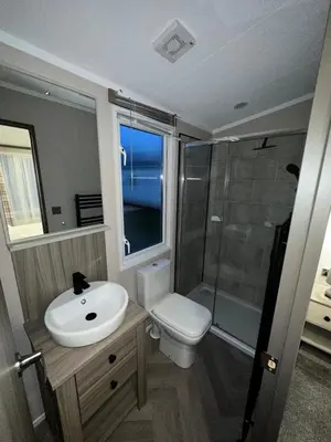 a bathroom with a sink and a toilet and a shower at Neptune in Parkeston