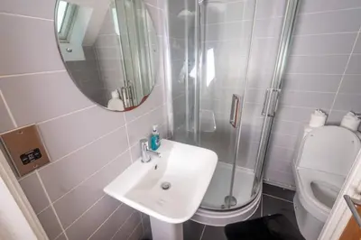 a bathroom with a sink and a shower and a toilet at Newly Renovated Sanctuary for 4 in Charlotte House in Ipswich