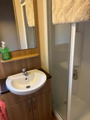a bathroom with a sink and a shower at 2 Bedroom caravan in Saint Osyth