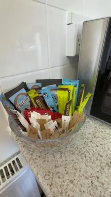 a bowl of utensils on a counter in a kitchen at Peaceful Springfield Studio in Chelmsford