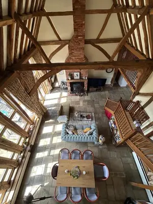 an overhead view of a living room with a couch at Heritage Cottage with a Pool in Diss