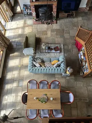an overhead view of a living room with a couch and chairs at Heritage Cottage with a Pool in Diss