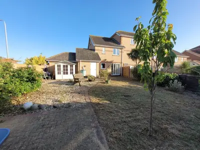 a small tree in the yard of a house at Seaview house - Three bedroom house with close access to beach by Catchpole Stays in Clacton-on-Sea